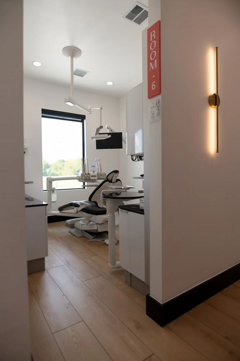 Hallway view into a Village Dental Studio hygiene treatment room